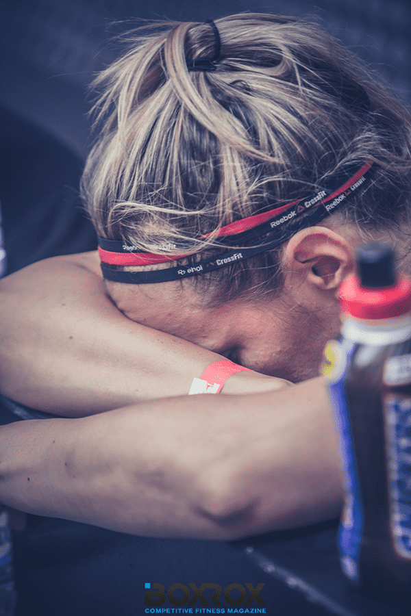 Problems that female crossfit athletes face, Female-Crossfitter-resting-after-tough -Workout