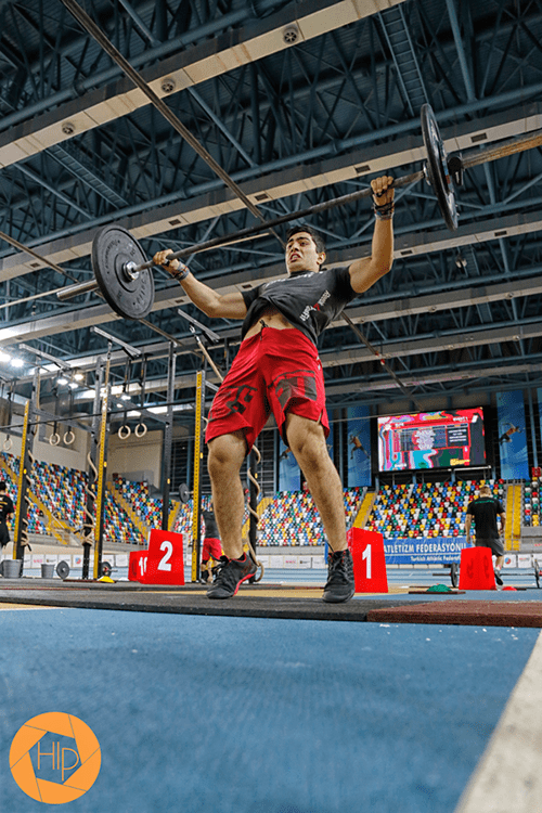 male crossfiter snatch barbell lift in competition