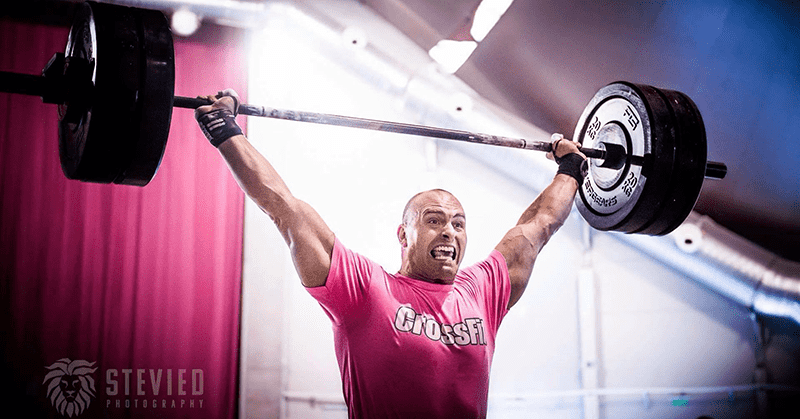 male crossfit athlete barbell lift in oly lifting shoes