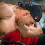 male crossfitter in the zone on assault bike visualisation cable exercises