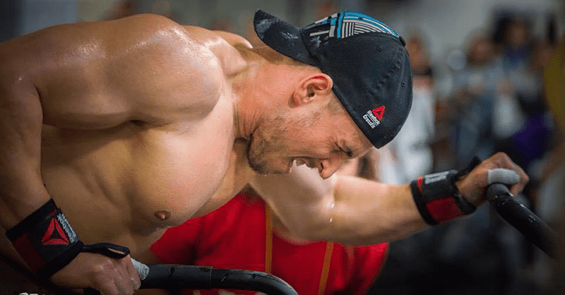 male crossfitter in the zone on assault bike visualisation cable exercises