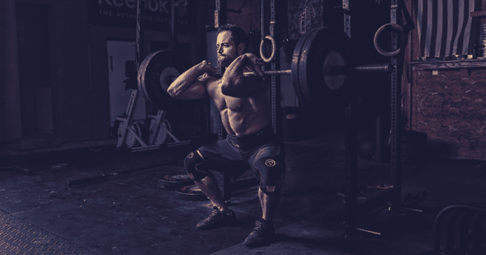 rich froning does a front squat in crossfit box