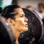 female crossfit athlete face determined in zone