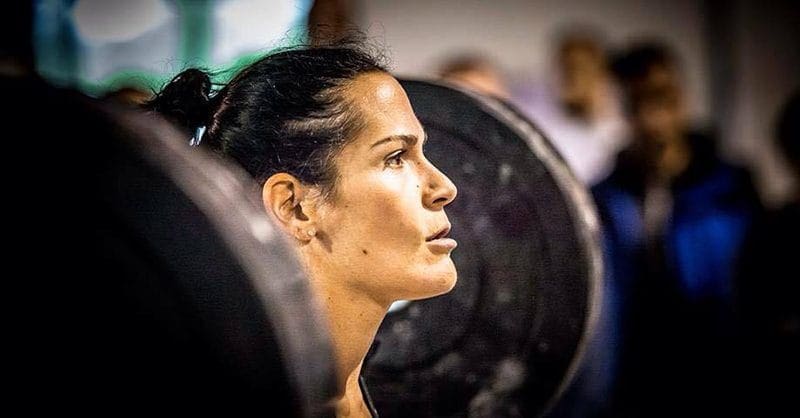 female crossfit athlete face determined in zone