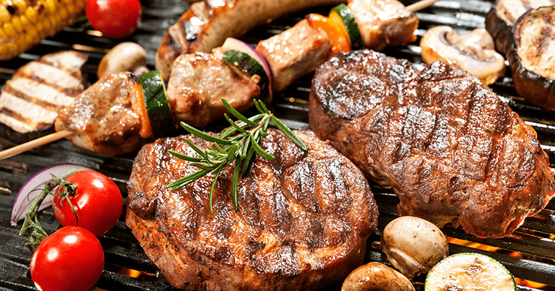 meat steaks, kebabs and vegetables flame grilled paleo bbq