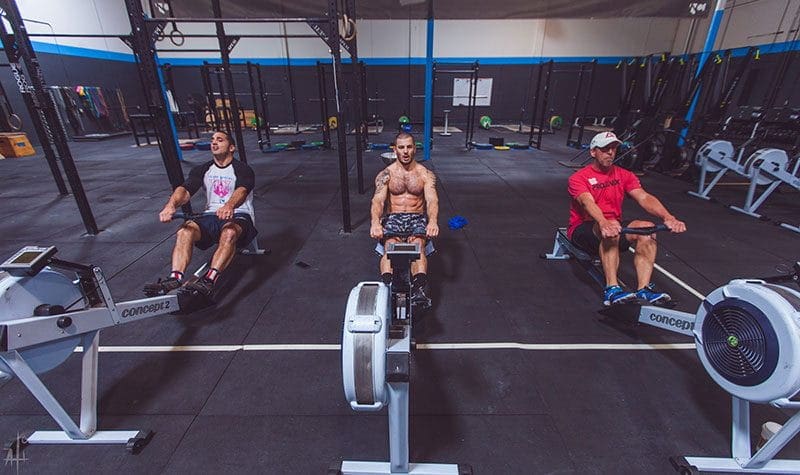 Chris Hinshaw training mat fraser and jason khalipa on the rowing machine