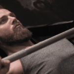 male freeletics athlete bench pressing through training plateau