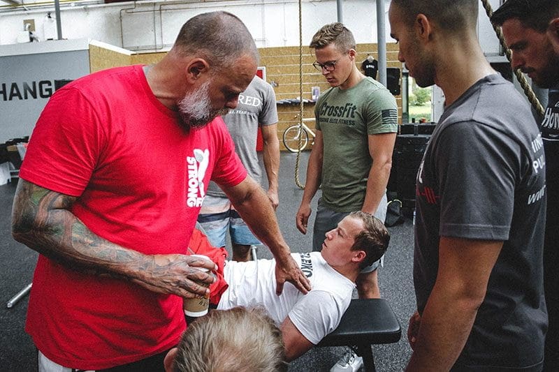 Julien Pineau crossfit coach works with athletes