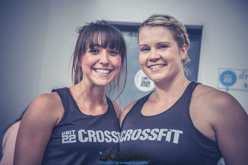 two crossfit female athletes smiling