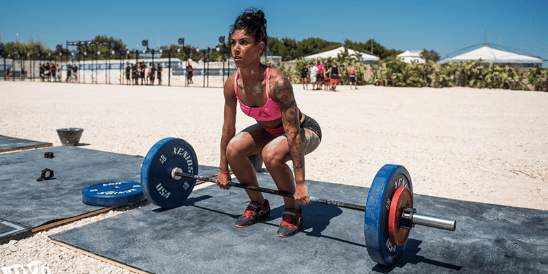 crossfit girl emom workouts outside beach