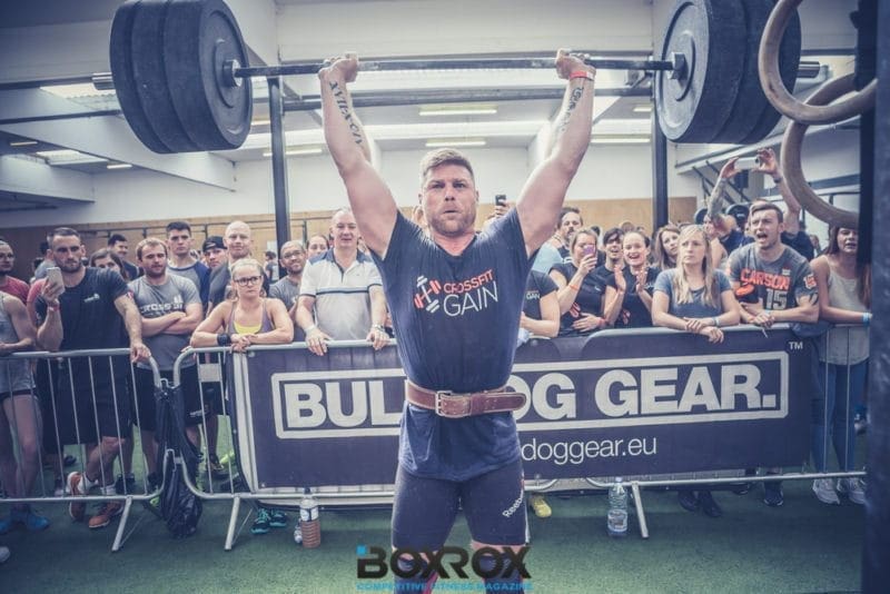 male crossfit athlete barbell clean and jerk