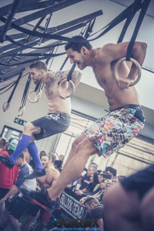 ring muscle ups two male crossfit athletes