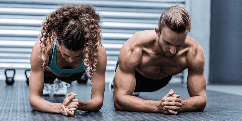 static holds abs exercise male and female athlete perform plank exercises