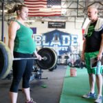 pregnant athlete performs deadlift back workouts