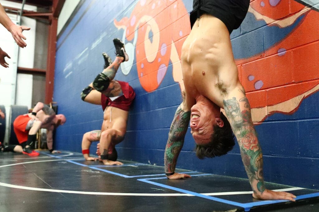 effective bodyweight workouts include handstand push ups, learn how to make your own CrossFit-style workouts