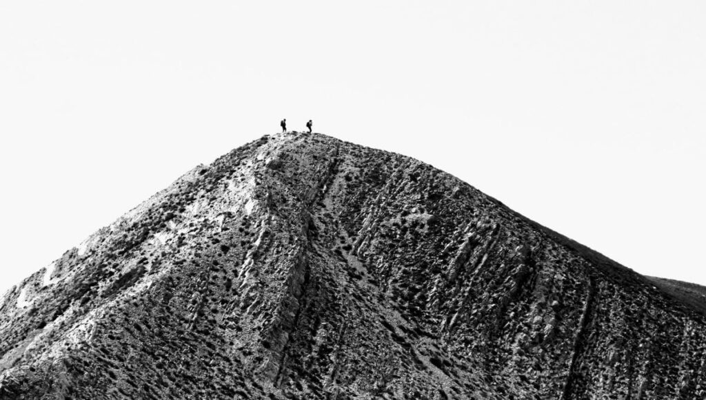 runners on top of a hill