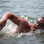 swimming in open water Why NOT Showering Cold is KILLING Your Gains