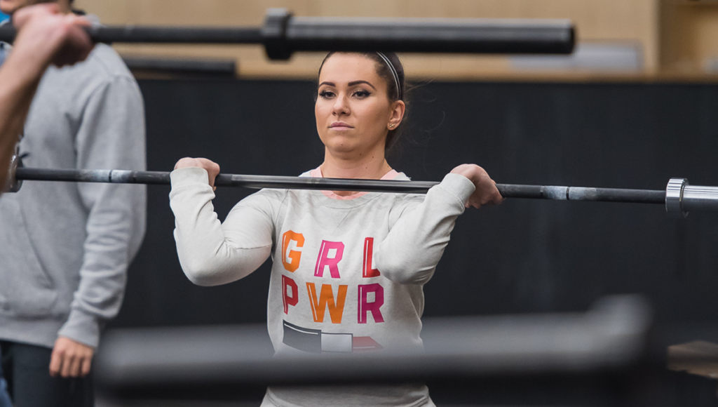 woman warm up with barbell
