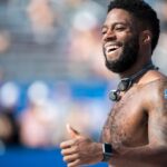 athlete smiles in continued learning from training guides