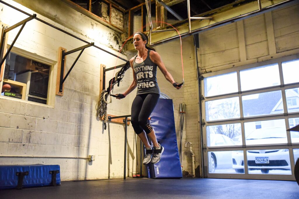 Woman jumps high during single unders workouts