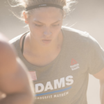 young athlete sprints up a hill