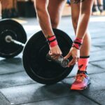 athlete sets up barbell for pendlay row