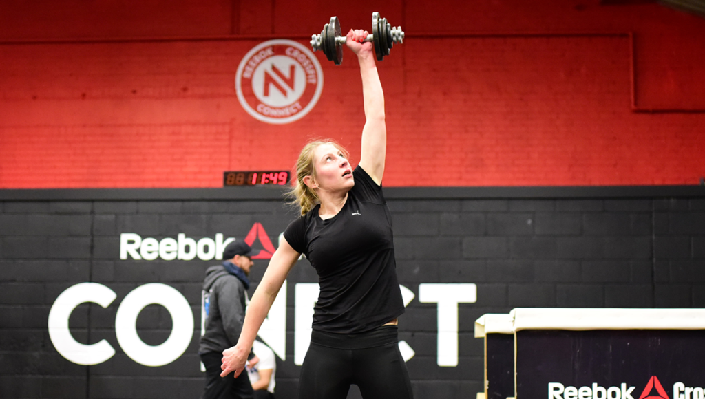 woman snatches dumbbell Best vs Worst Shoulder Exercises