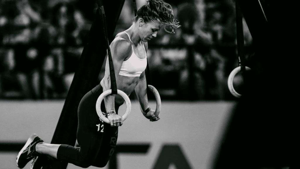 Kristen Holte competing during ring muscle up event 10 Rules of Calisthenics