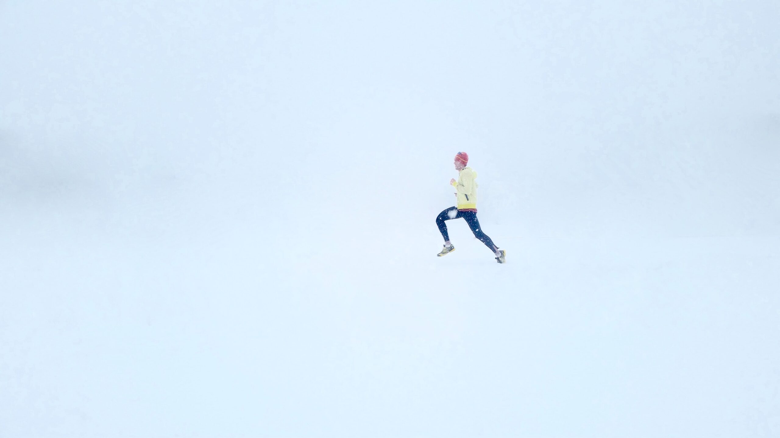 athlete runs in snow