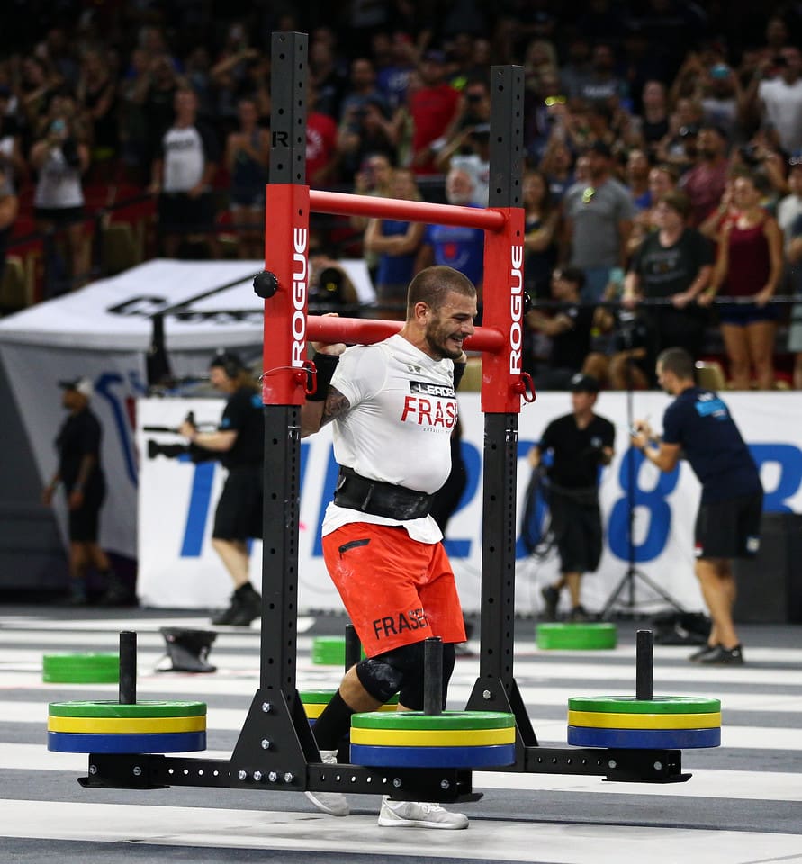 mat fraser during 2018 crossfit games final with yoke carry