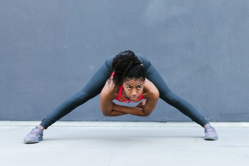 female athlete stretches before sport