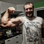 devon larratt shows off bicep