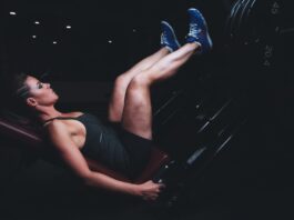 Woman does leg press at the gym