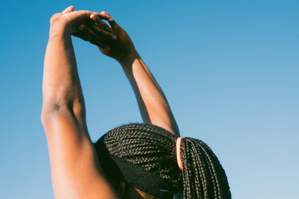 forearm stretch against sky