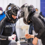 tia toomey fist bumps teammate after qualifying for 2022 winter olympics in bobsleigh