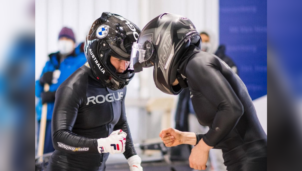 tia toomey fist bumps teammate after qualifying for 2022 winter olympics in bobsleigh