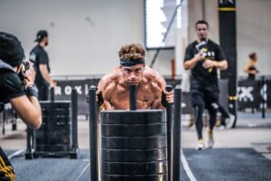 Hunter McIntyre pushes sled