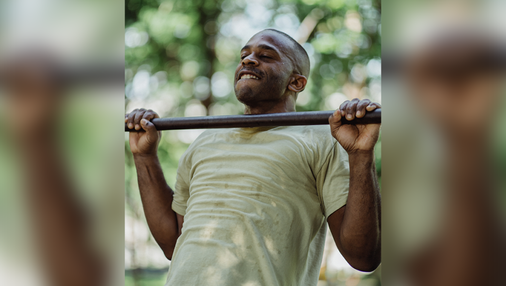 man performs a pull-up