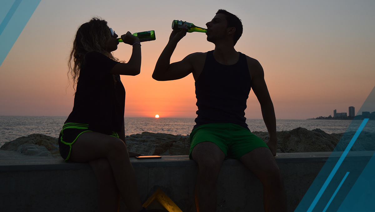 athletes drinking by sunset