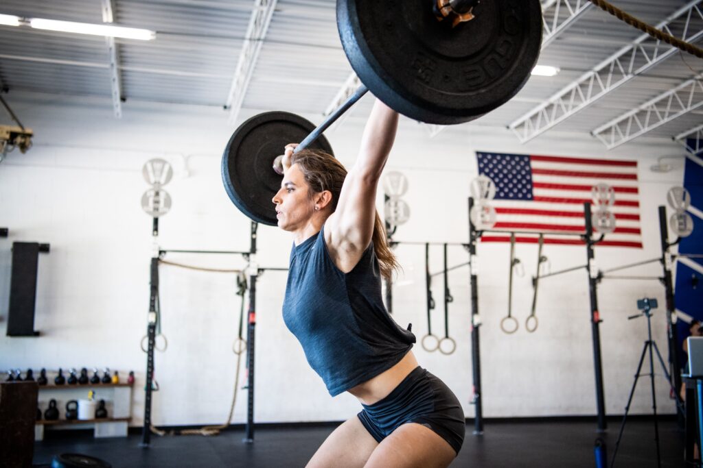 athlete performs power snatch