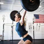 athlete performs power snatch
