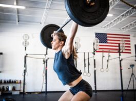 athlete performs power snatch