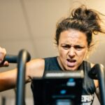 athlete does cardio session on echo bike