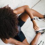 athlete looks at wrist watch with optical heart rate monitor