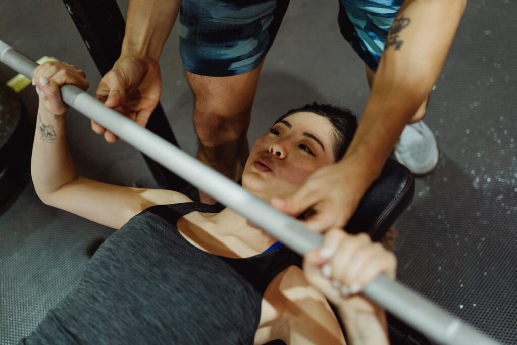 athlete performs exercises to improve bench press