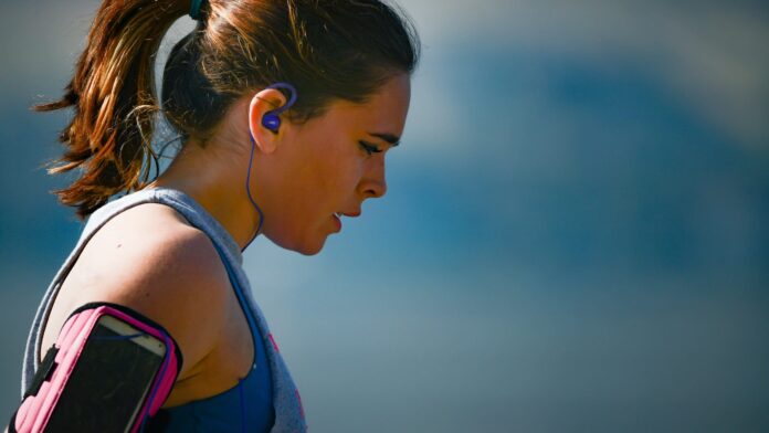 woman enjoys the benefits of exercise for managing negative mental health symptoms after run