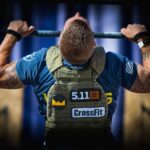 man performs crossfit pull-ups with weight vest Back Strength and Muscle Without Pull Ups Total Carbs vs Net Carbs