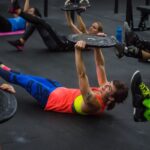 athlete performs Dave Durante core workout with hollow hold