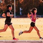 two track athletes run fast