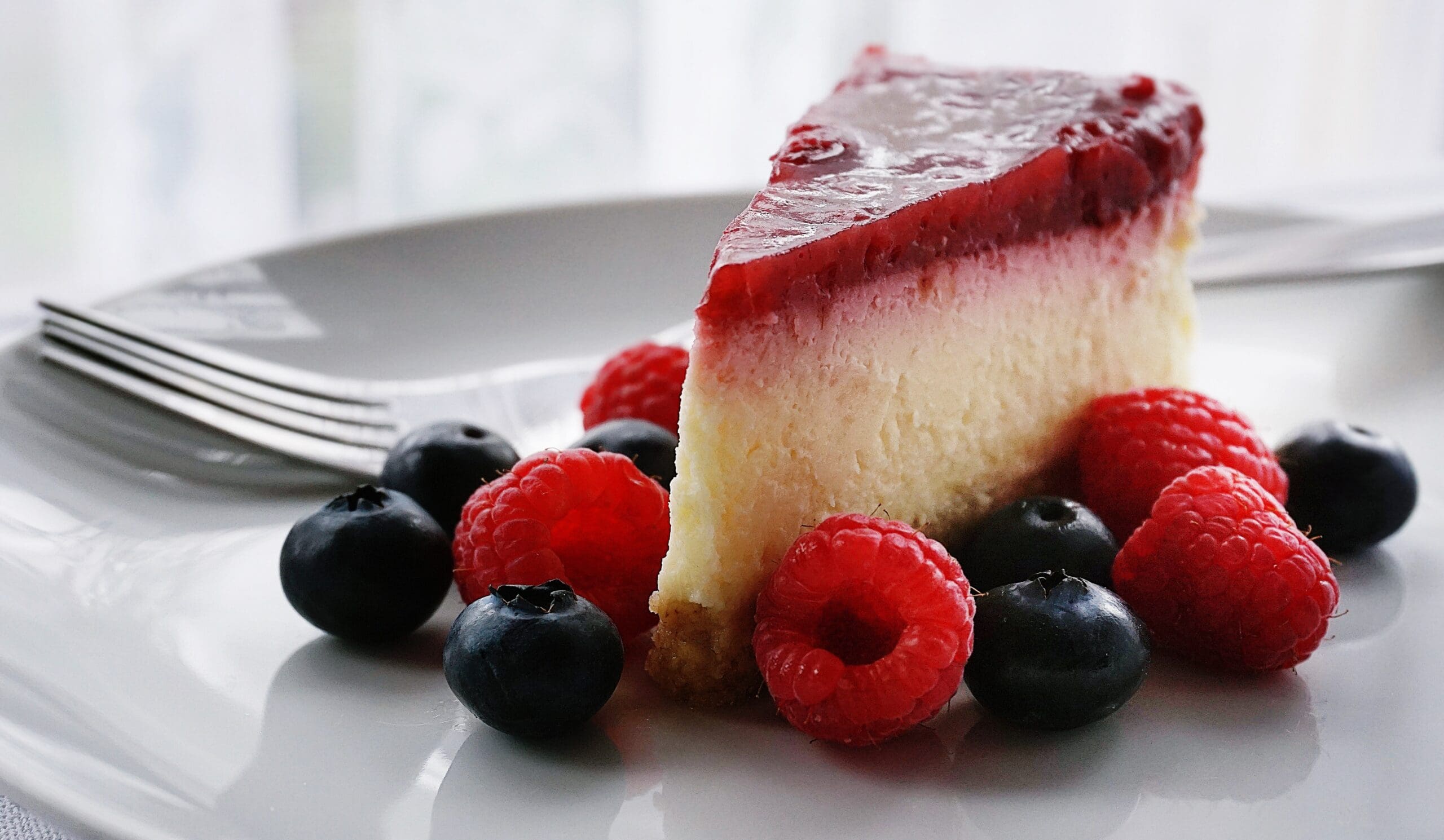 slice of protein cheesecake with berries